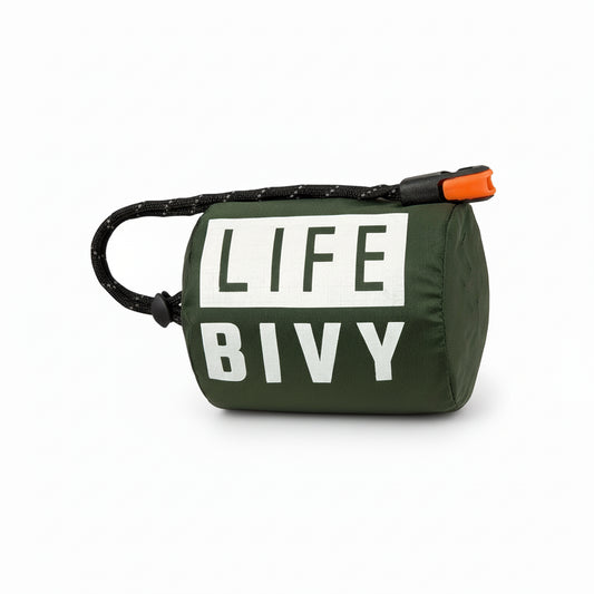 Green emergency thermal bivy designed to retain body heat in cold and wet conditions, compact survival sleeping bag for outdoor and emergency use