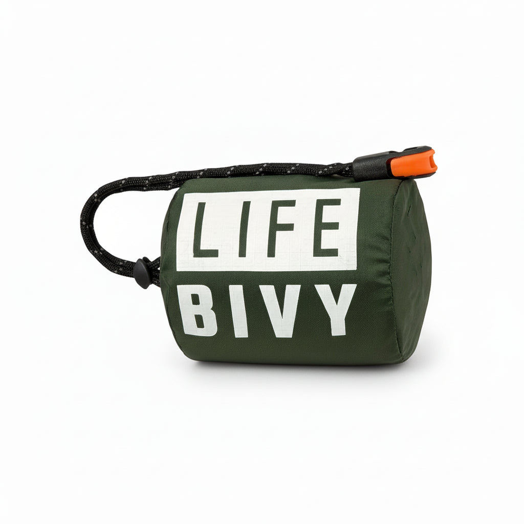 Green emergency thermal bivy designed to retain body heat in cold and wet conditions, compact survival sleeping bag for outdoor and emergency use