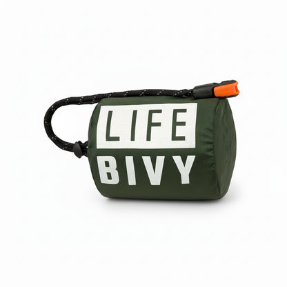 Green emergency thermal bivy designed to retain body heat in cold and wet conditions, compact survival sleeping bag for outdoor and emergency use