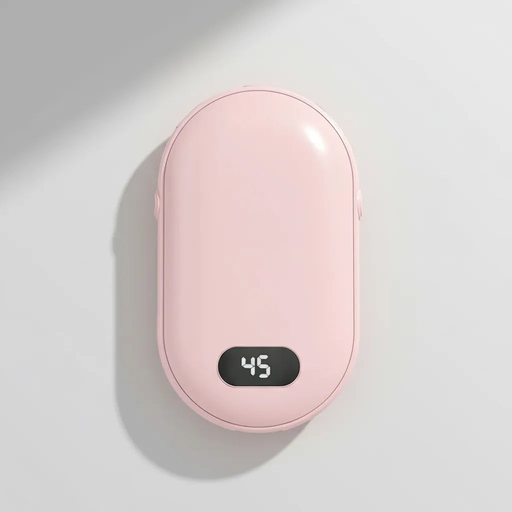 Pink handheld warmer with digital temperature display on a light gray background