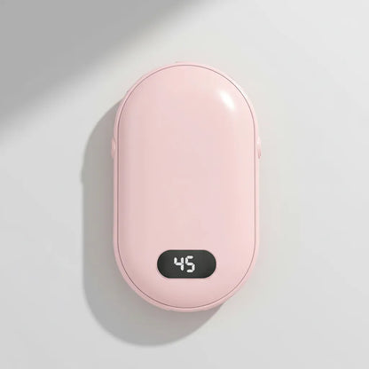 Pink handheld warmer with digital temperature display on a light gray background